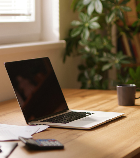 Open laptop on a desk, ready for a virtual coaching discovery call.